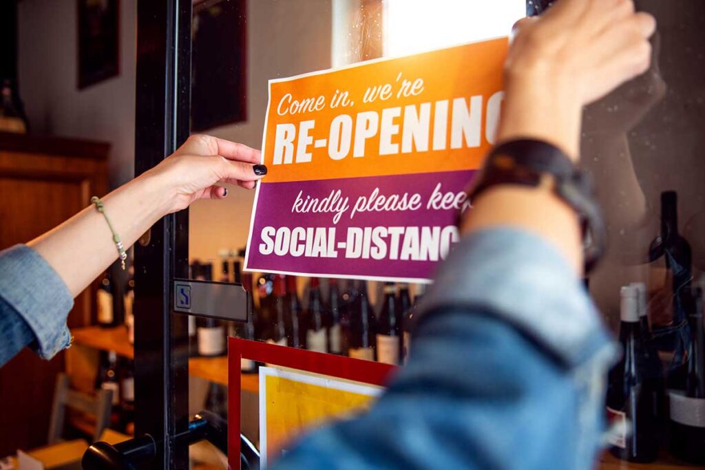 Open sign in a small business shop after Covid-19 pandemic